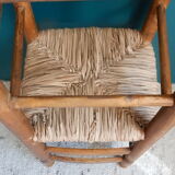 Children's high chair made of wood and straw