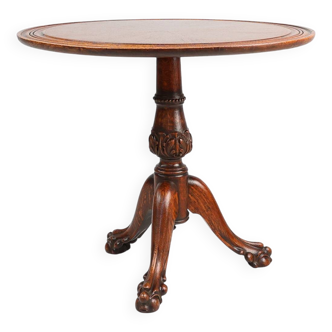 Antique English hand carved circular oak side table with lions head feet