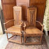 Pair of Renaissance style carved walnut armchairs