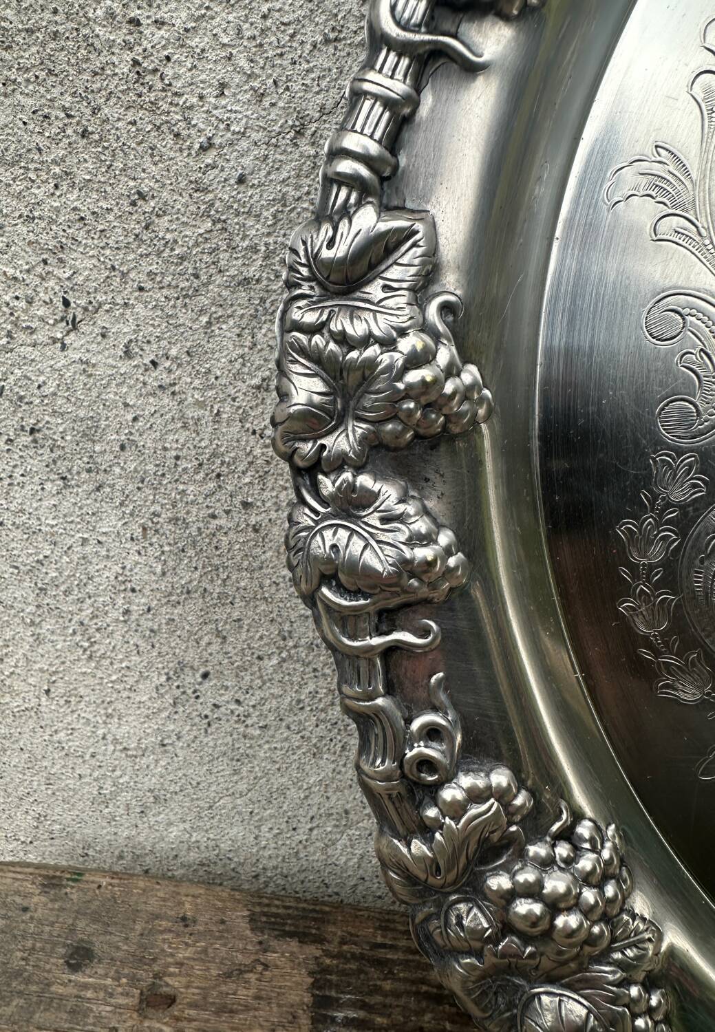 Antique round silver serving platter, grape motifs.