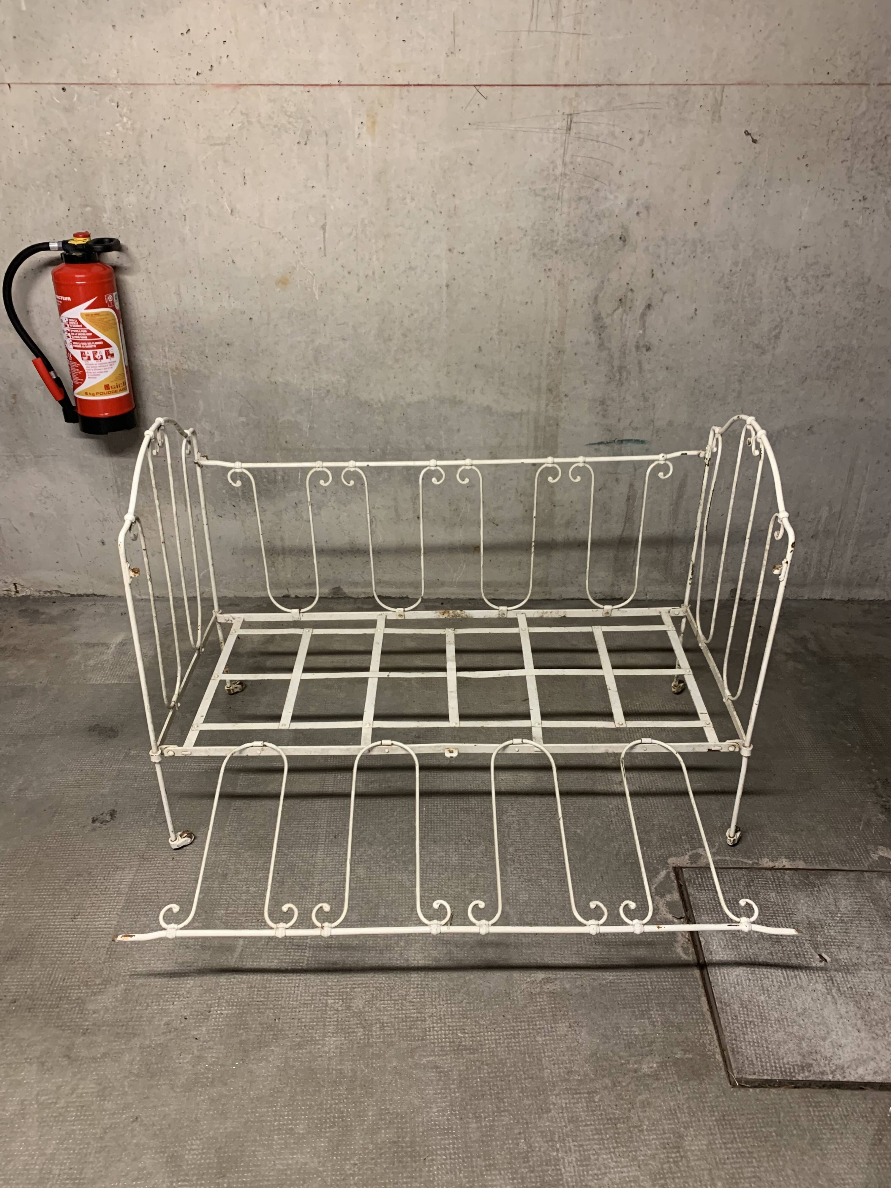 Old vintage wrought iron bench bed