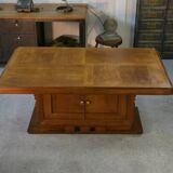 Solid oak table with central pedestal base and storage, Charles Dudouyt, 1950s