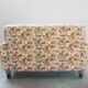 2-seater sofa, floral fabric, wooden structure, plastic and wooden legs, 1970