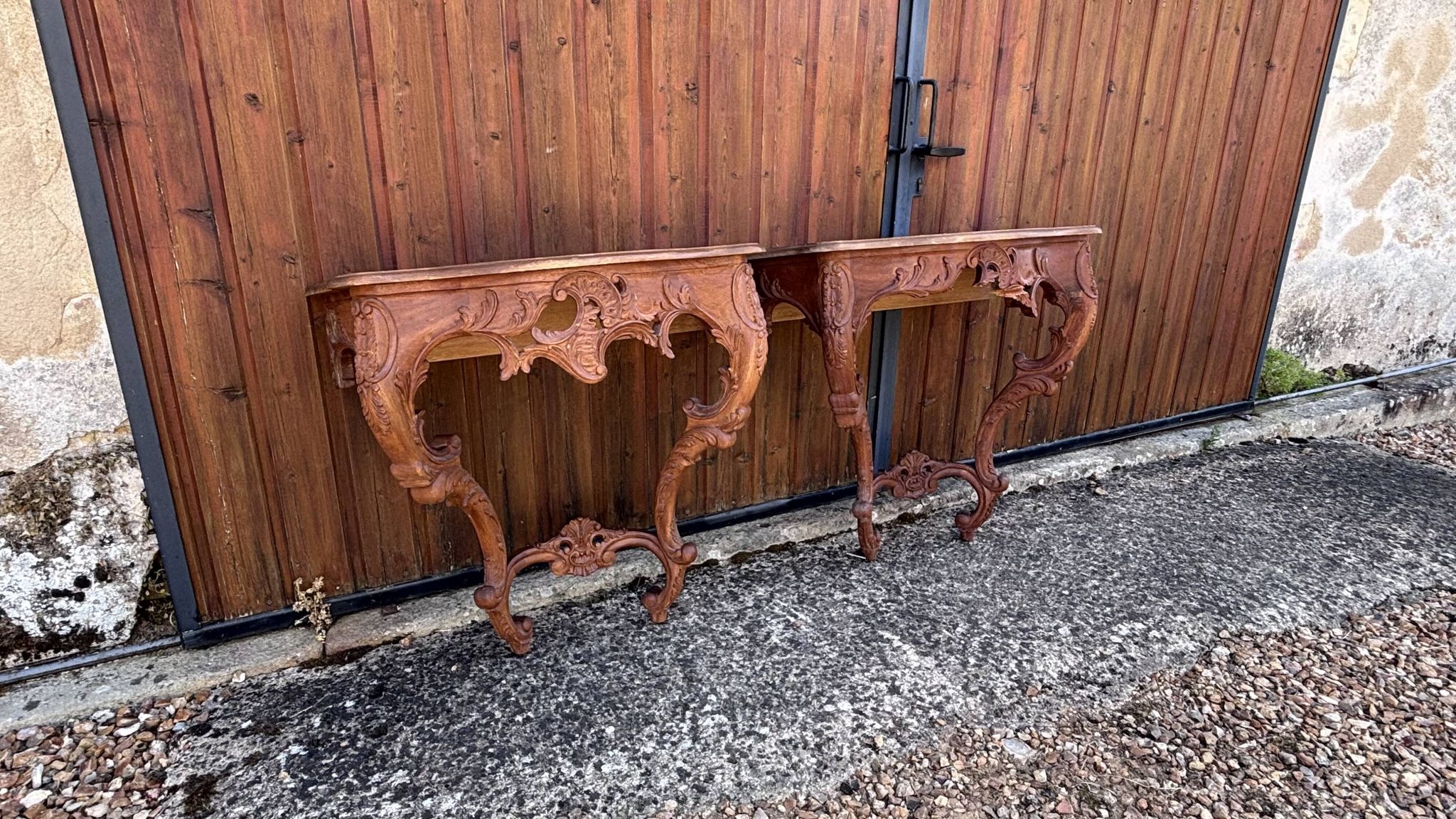 Pair of carved wall consoles in Louis XV style