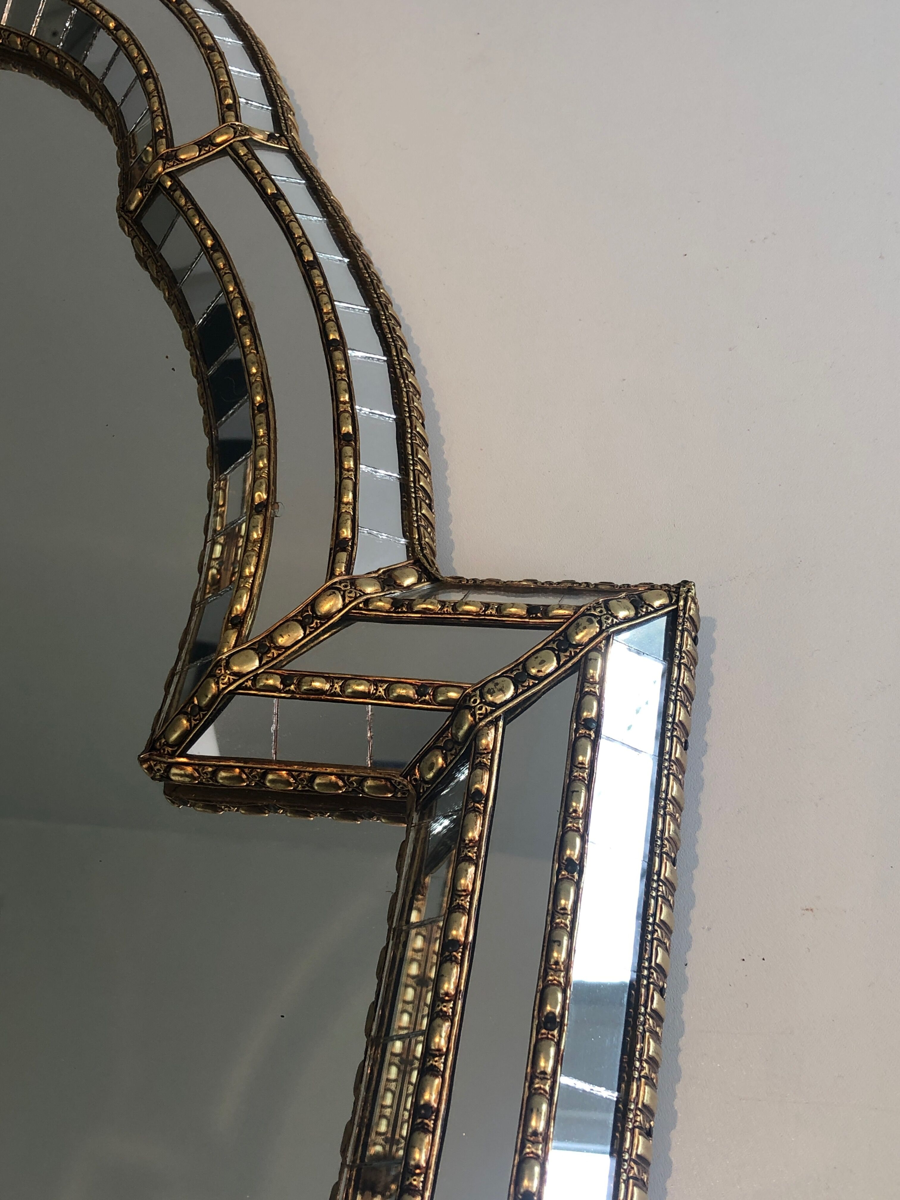 Mirror consisting of multi-faceted mirrors and brass garlands, French work, around 1970