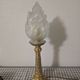 Table lamp with brass base and vintage flame globe