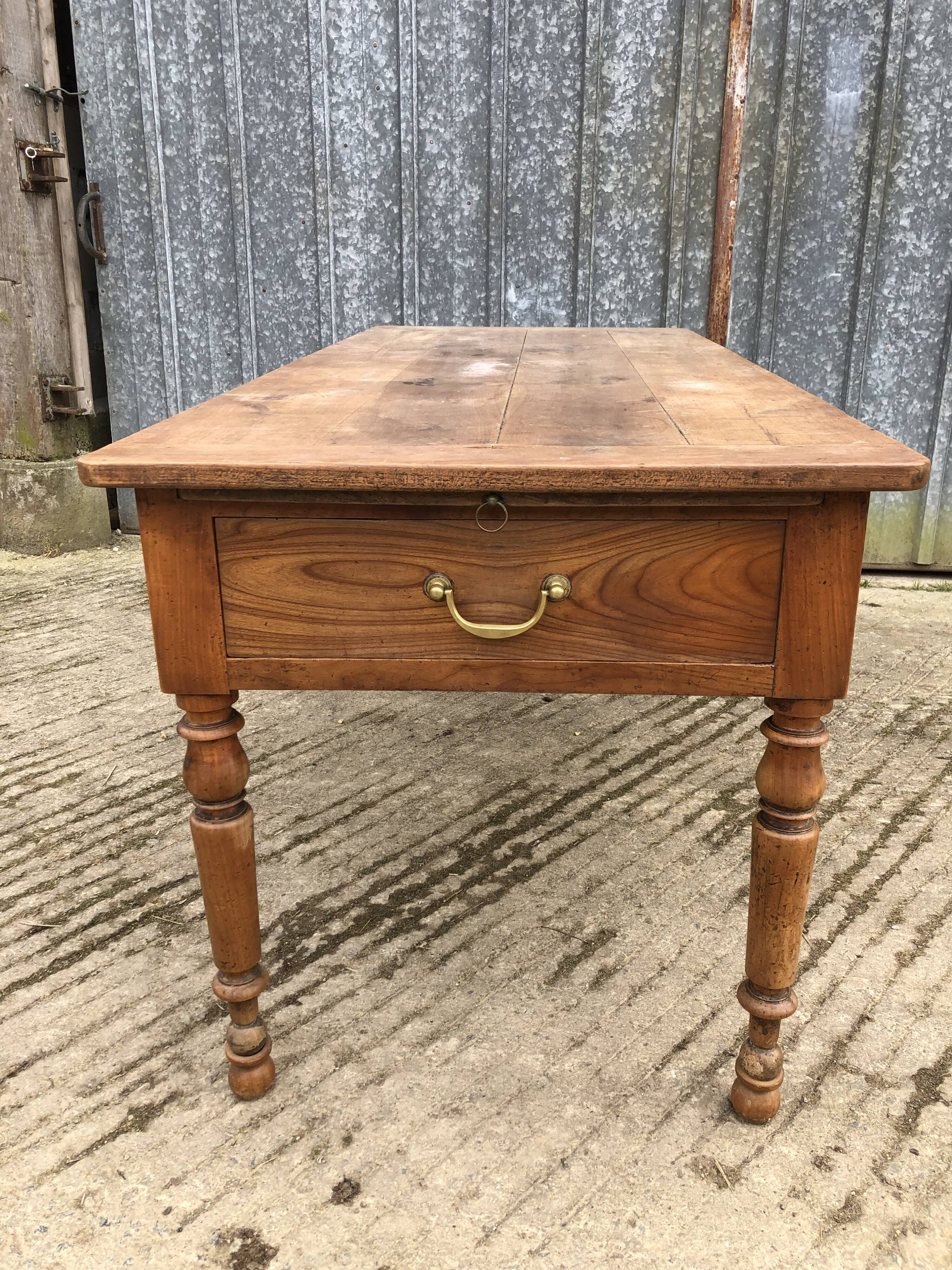 Antique cherry farmhouse table with 2 drawers and 1 pull-out