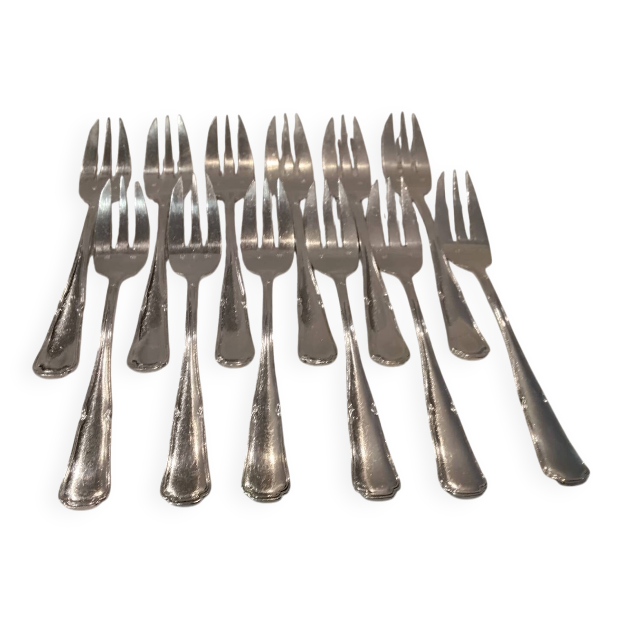 12 silver-plated metal cake forks by silversmith Guillaumot, contours