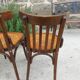 4 bentwood bistro chairs with a pattern on the seat