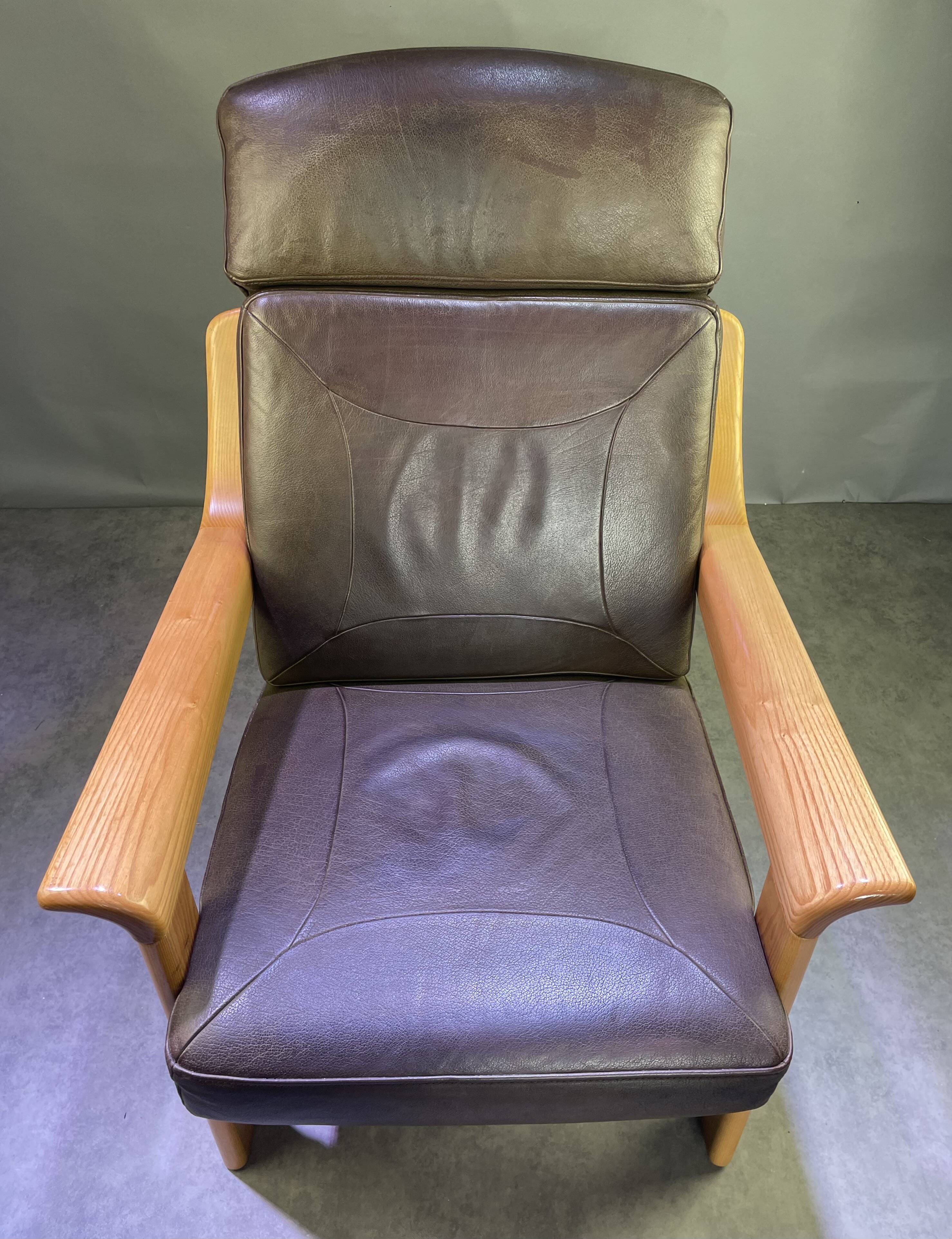 Chocolate leather armchair, wooden structure
