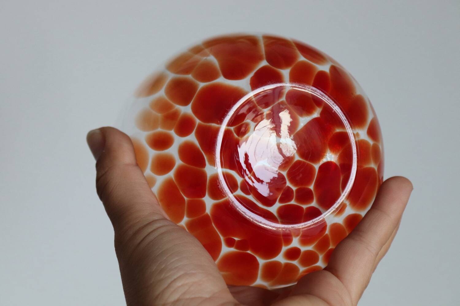 Vintage blown glass vase with a speckled red design