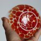 Vintage blown glass vase with a speckled red design
