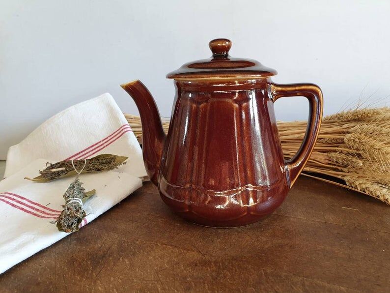 Vintage tea maker in old-fashioned country house-style earthenware
