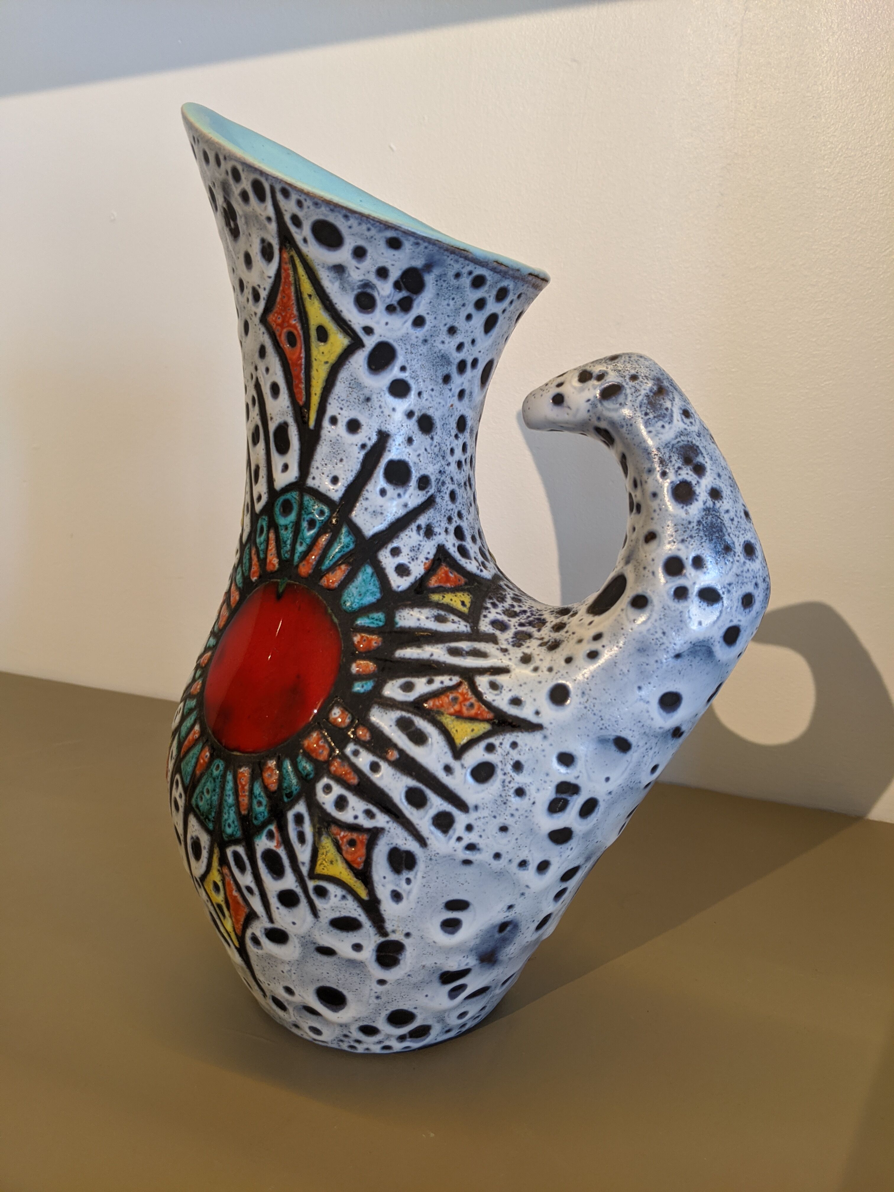 Granite ceramic pitcher and heart symbol