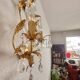 Hand-forged wall lamp gilded with gold leaf and crystals, Italy