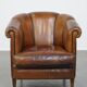 Unique vintage cognac-coloured leather club armchair with black piping