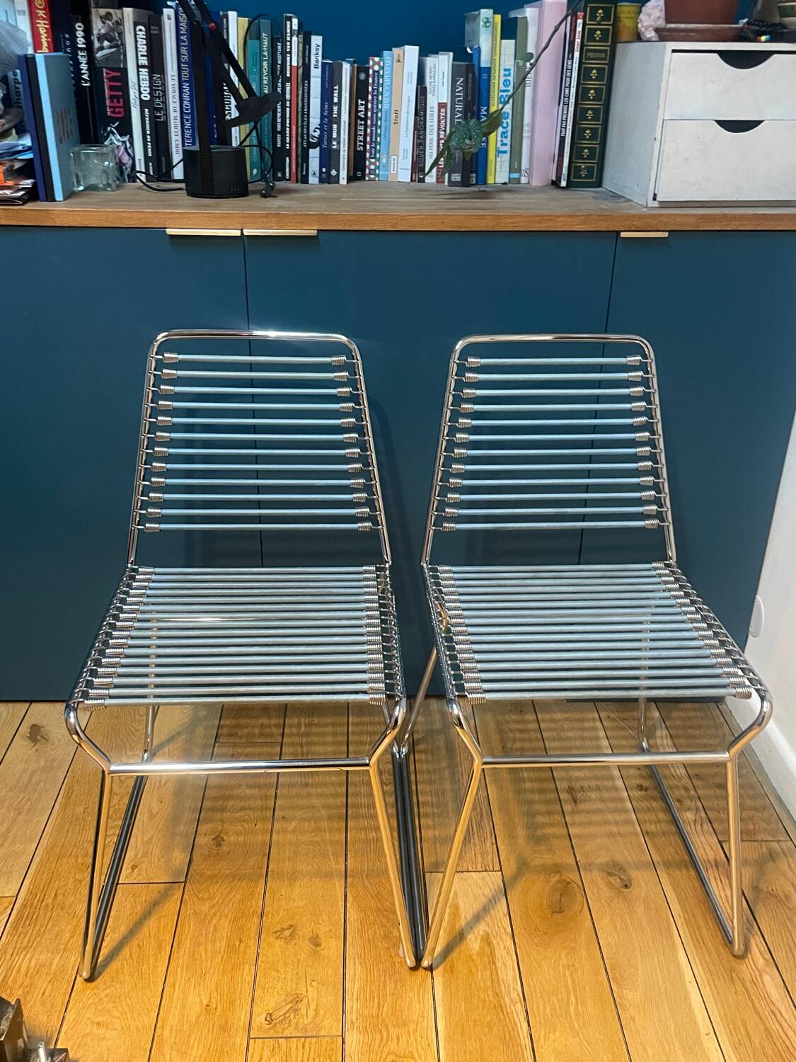 2 metal chairs with bungee cords