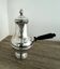 Silver-plated metal chocolate pot stamped ARGIT SFOA with an ebony handle.