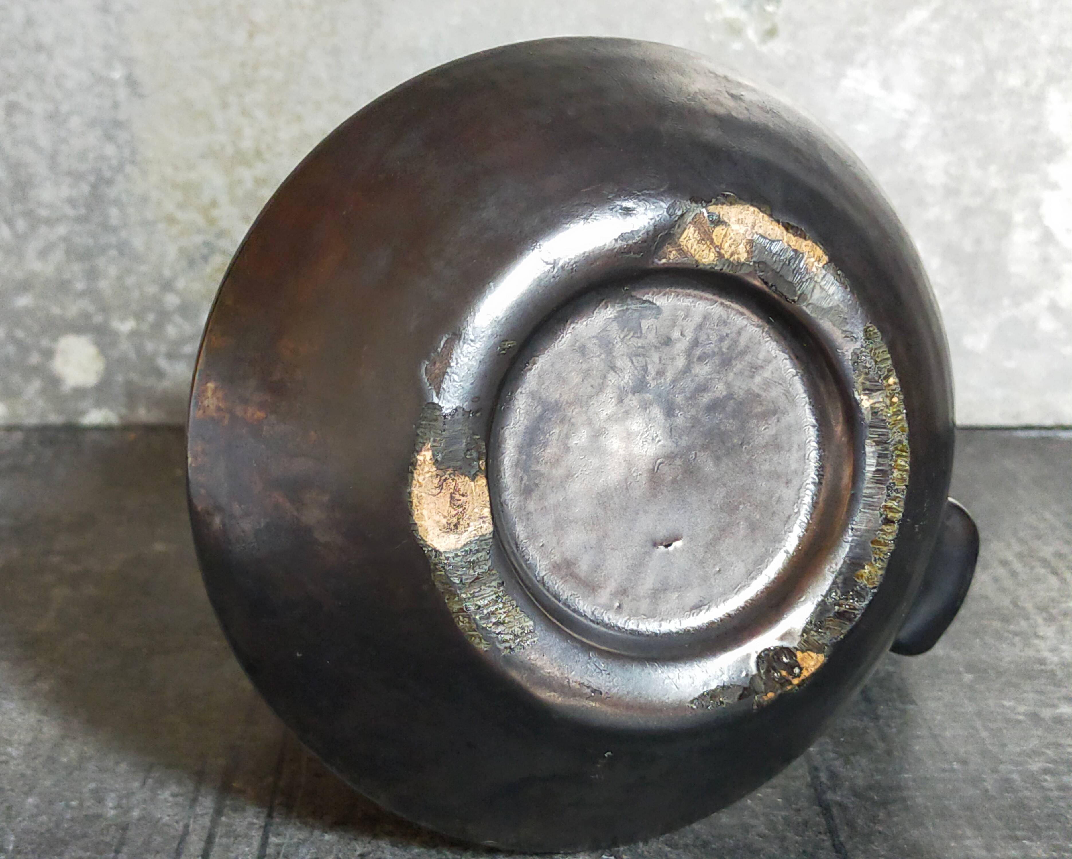 1950s iridescent black ceramic hand candle holder