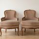 Pair of Louis XV armchairs in wood and beige fabric.