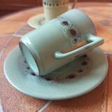 A pair of vintage glazed stoneware cups and saucers.