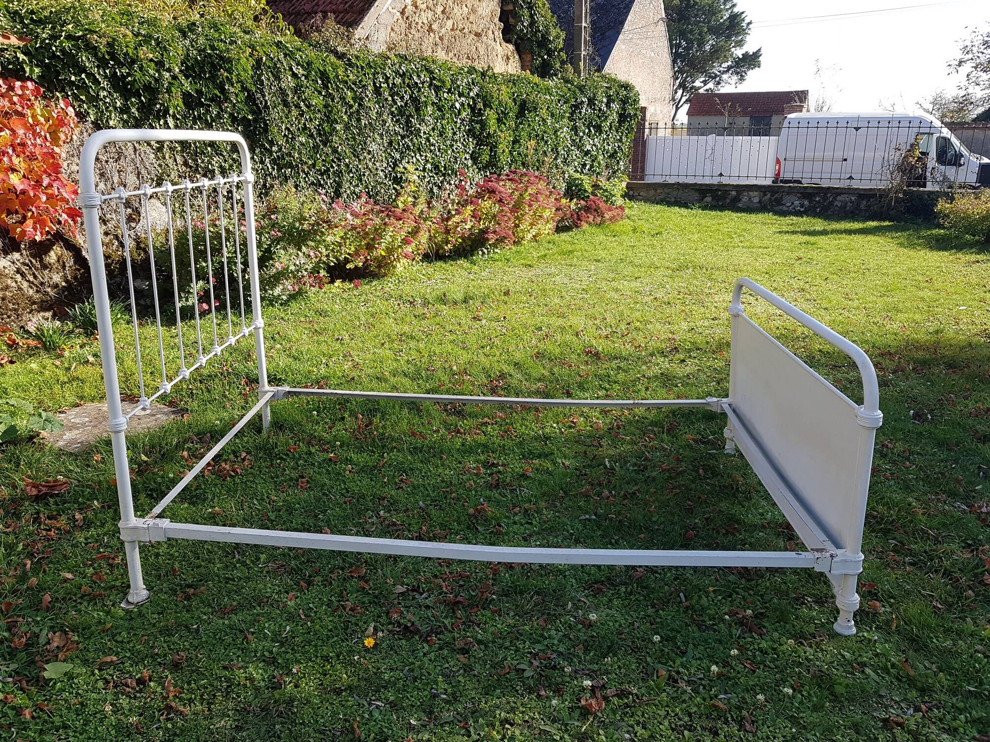 Old white metal bed from 1900