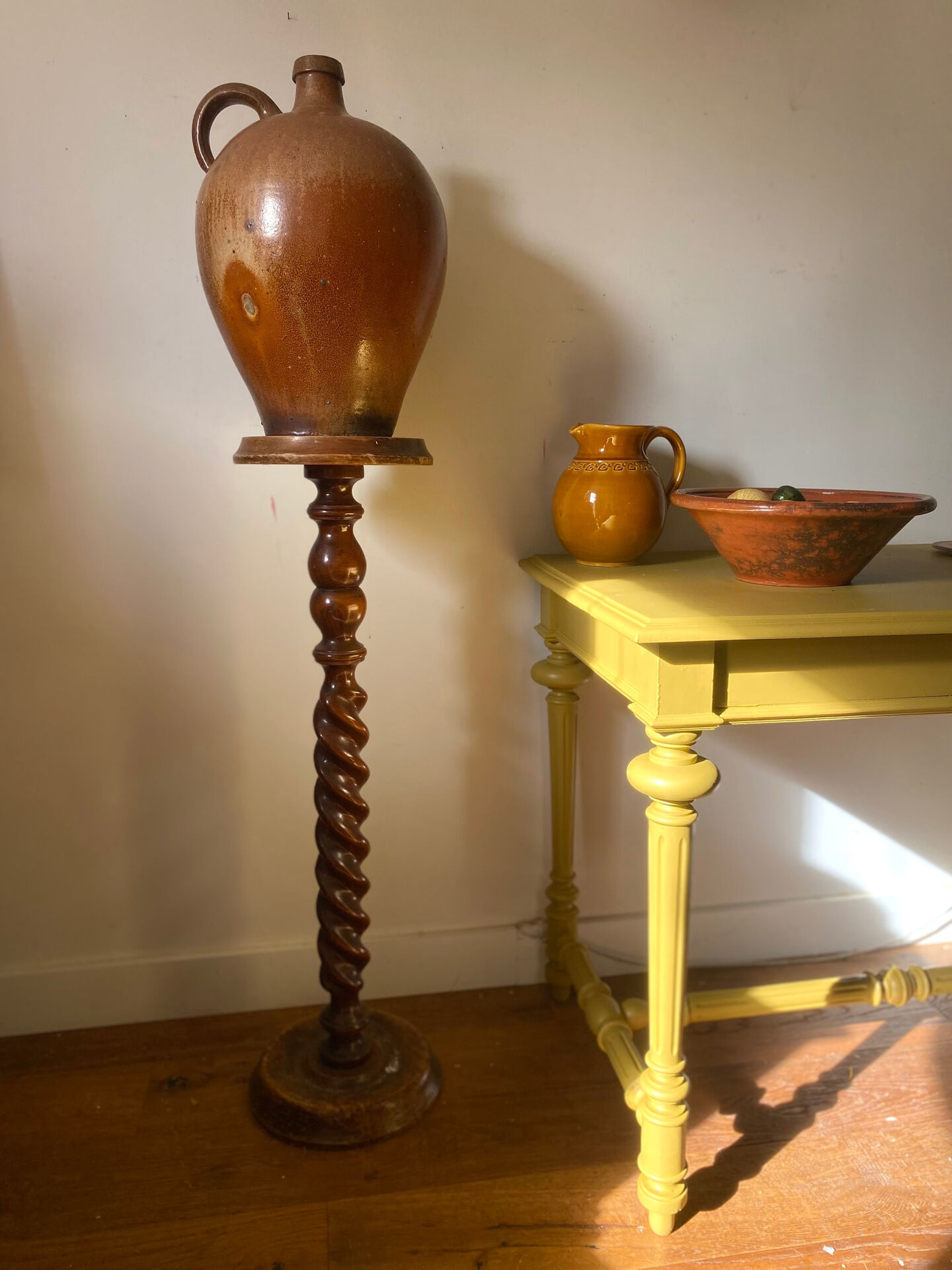 Antique pedestal table with a twisted column.