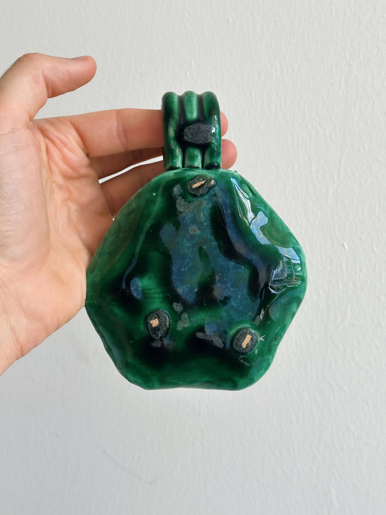 Vintage green glazed ceramic candle holder, organic design.