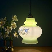 Vintage suspension globe in white and green opaline.