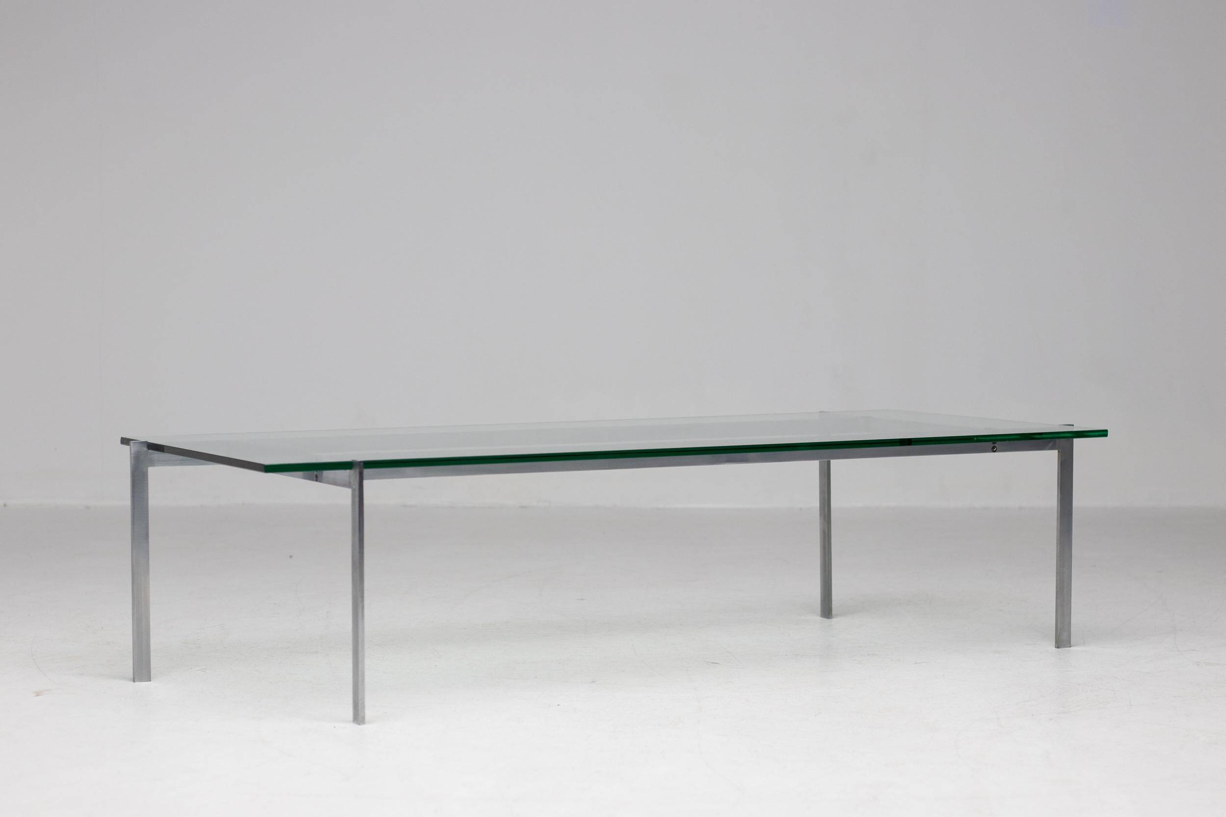 Architectural rectangular coffee table in steel and glass.