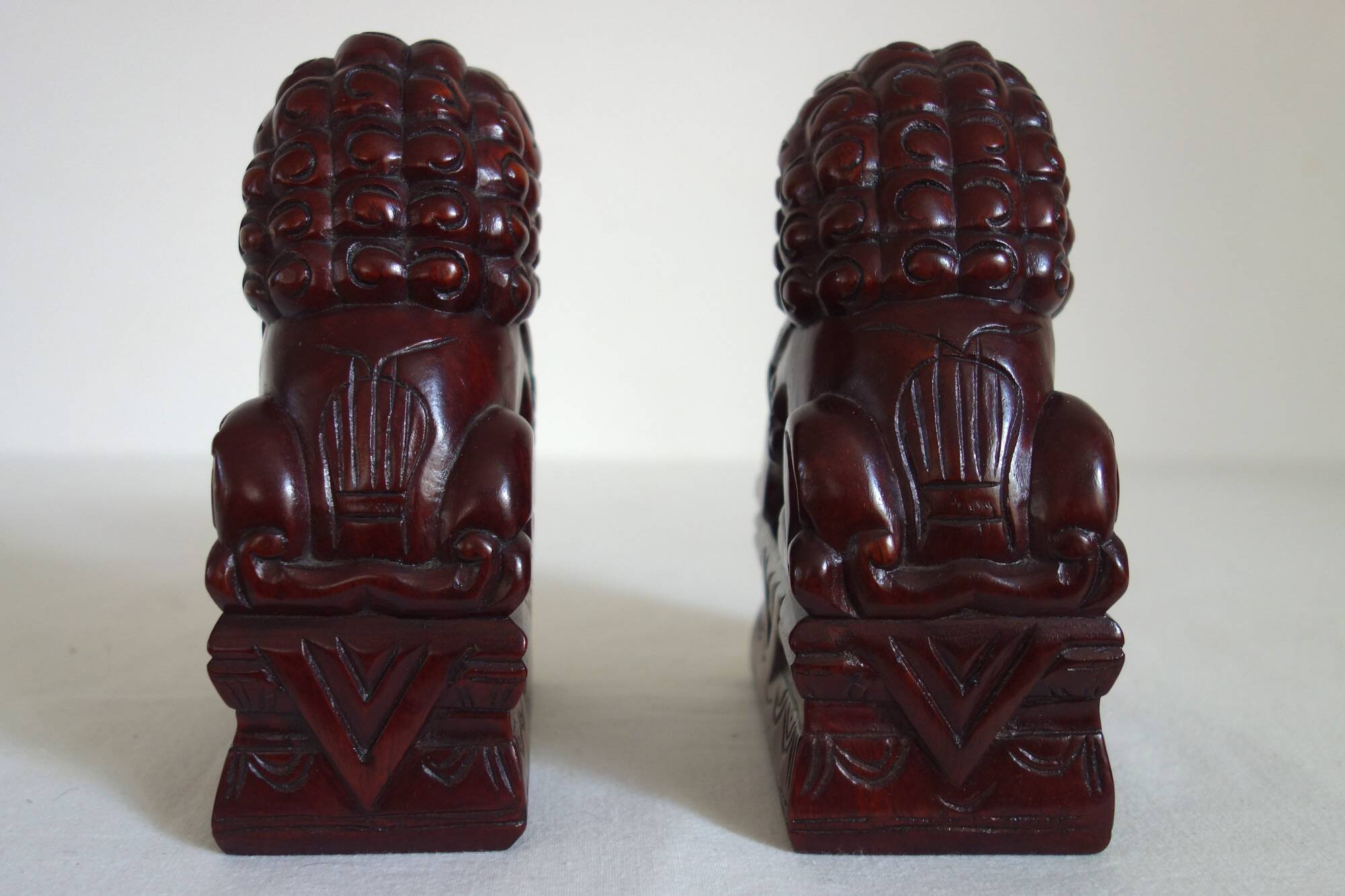 Vintage wooden pair of Foo dogs.