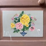 Large antique wardrobe painted with floral decoration.