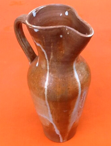 Glazed stoneware pitcher With white dripping on brown background Height: 270mm
