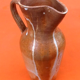 Glazed stoneware pitcher With white dripping on brown background Height: 270mm