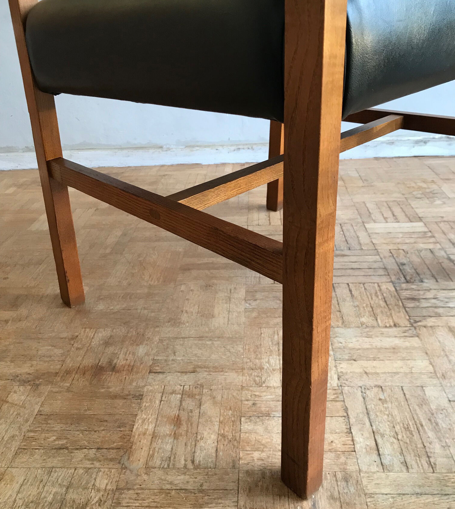 Chair in light teak and black skaï from the 1960s