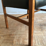 Chair in light teak and black skaï from the 1960s