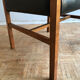 Chair in light teak and black skaï from the 1960s