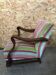 Old wooden armchair with curved armrests