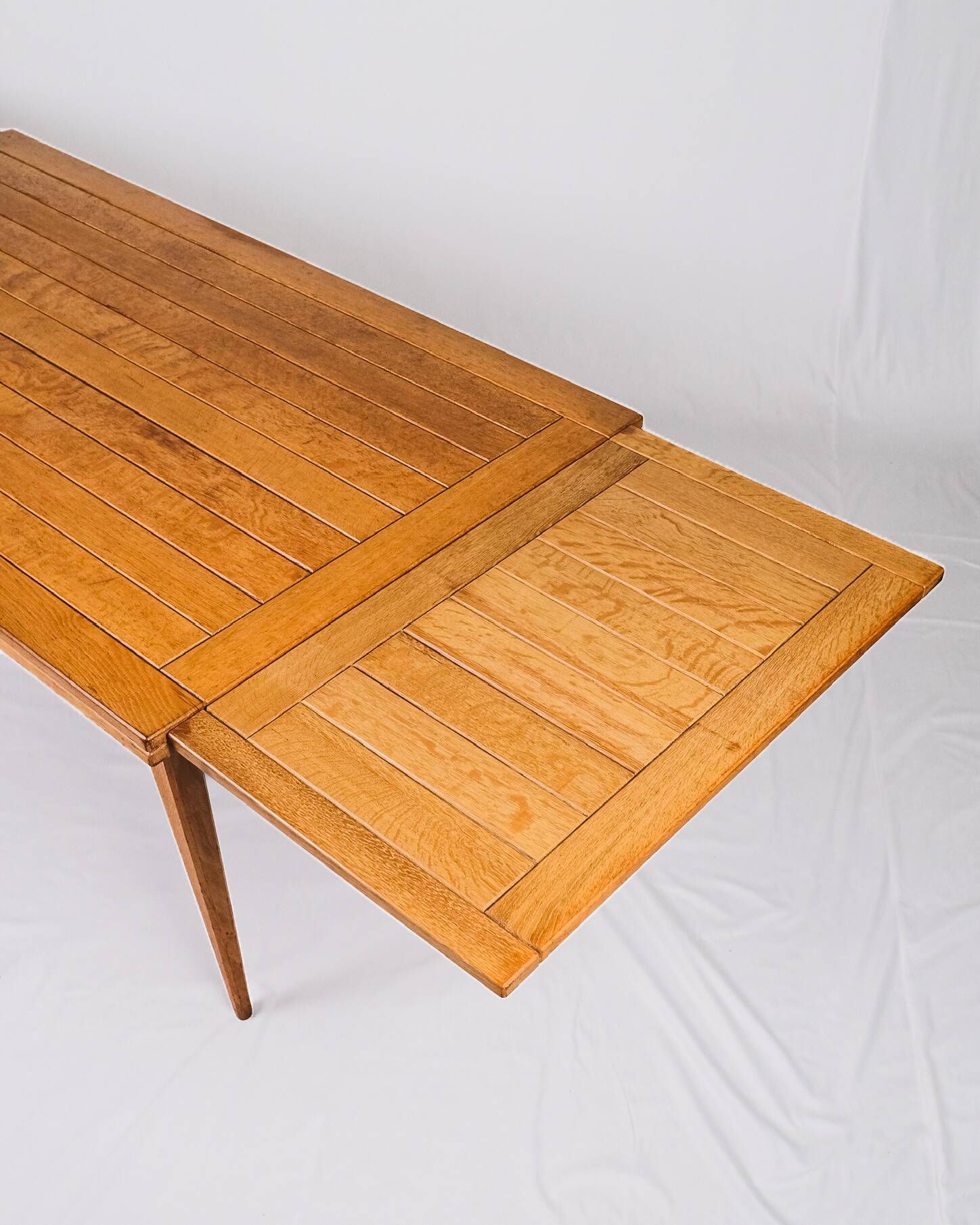 Extendable oak table in the style of Guillerme and Chambron, France 1960s