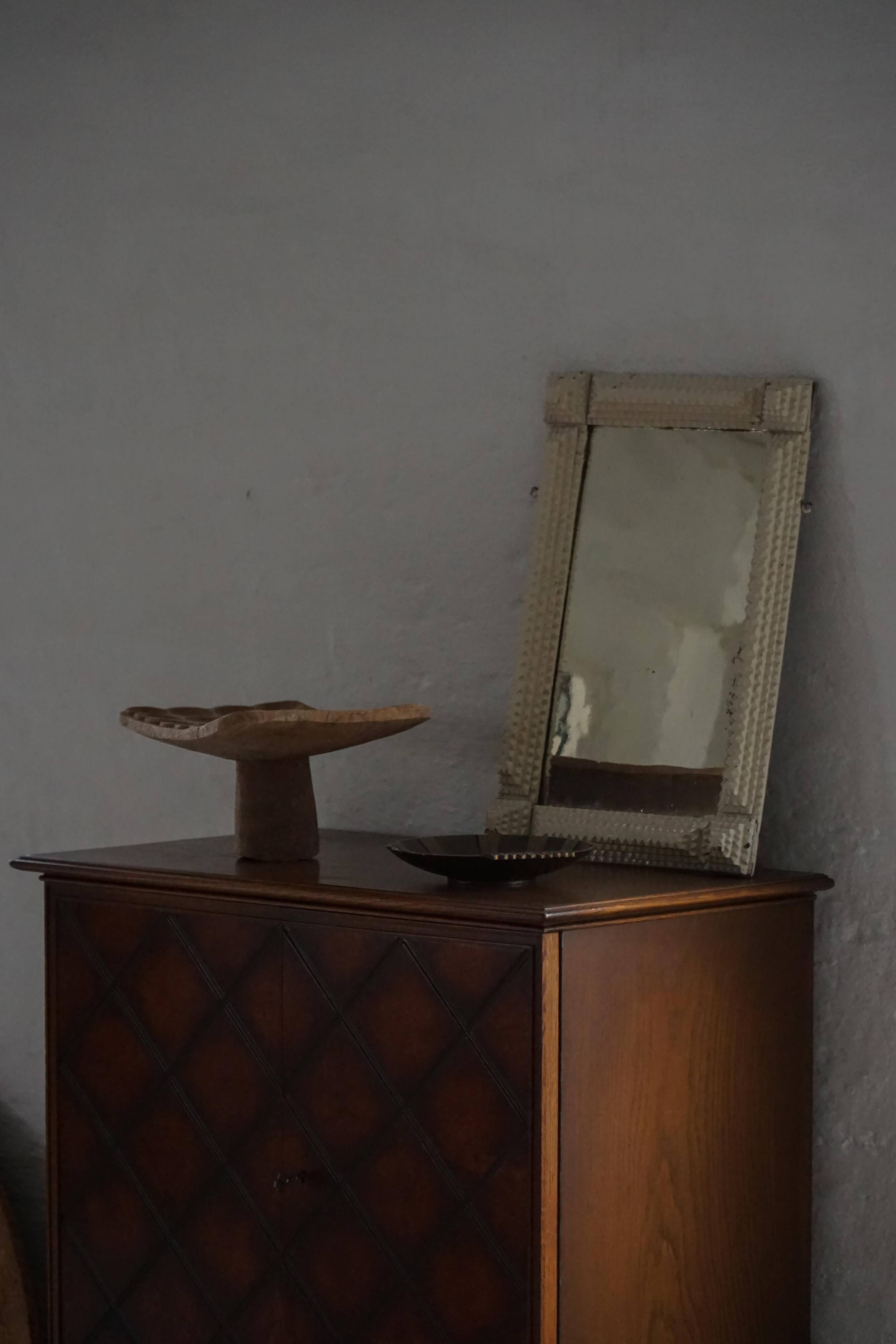 Wall mirror in tramp art style, hand-carved with a painted white frame, early 1900s.