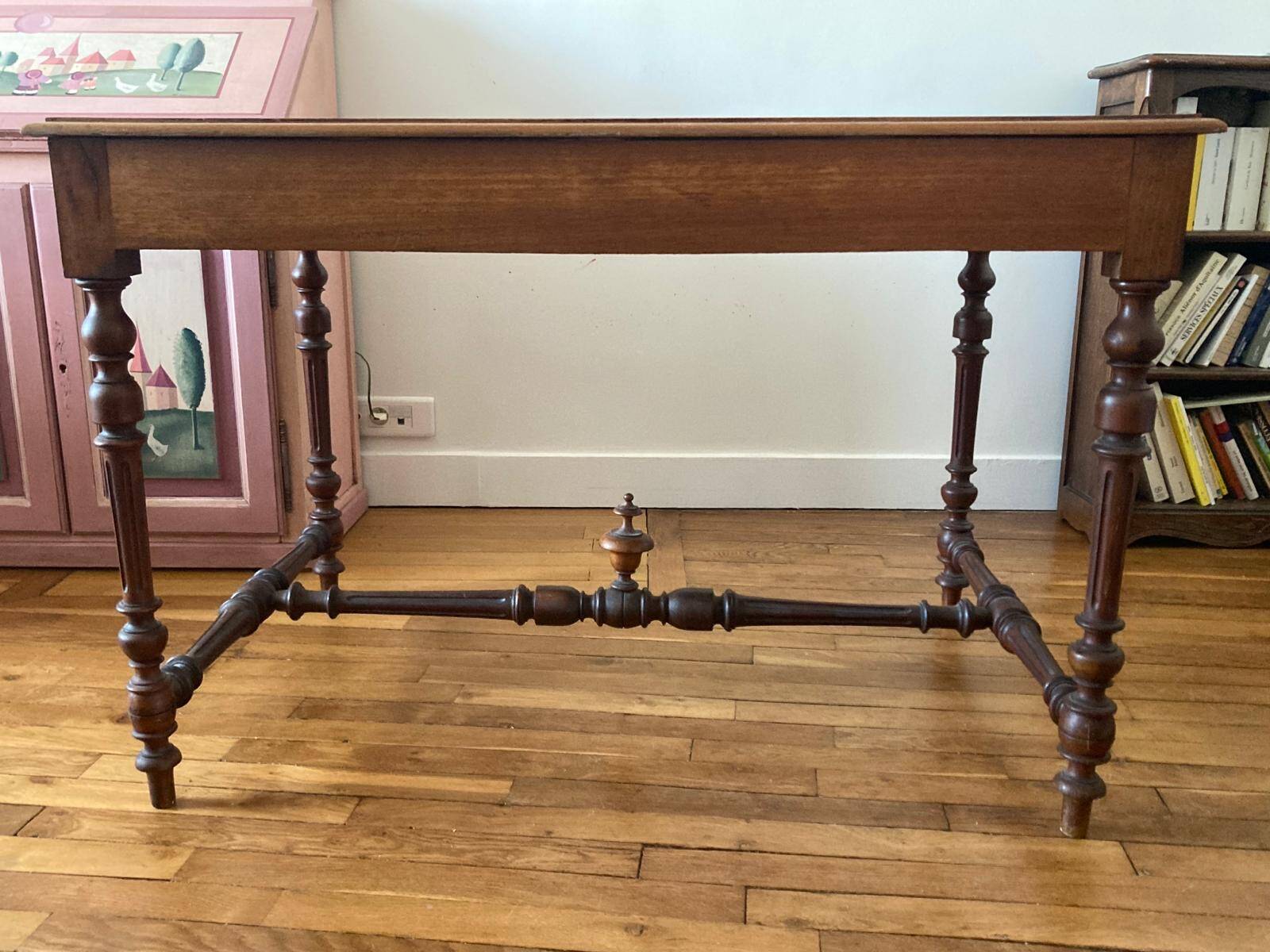 Table with a spacer topped with a spinning top.