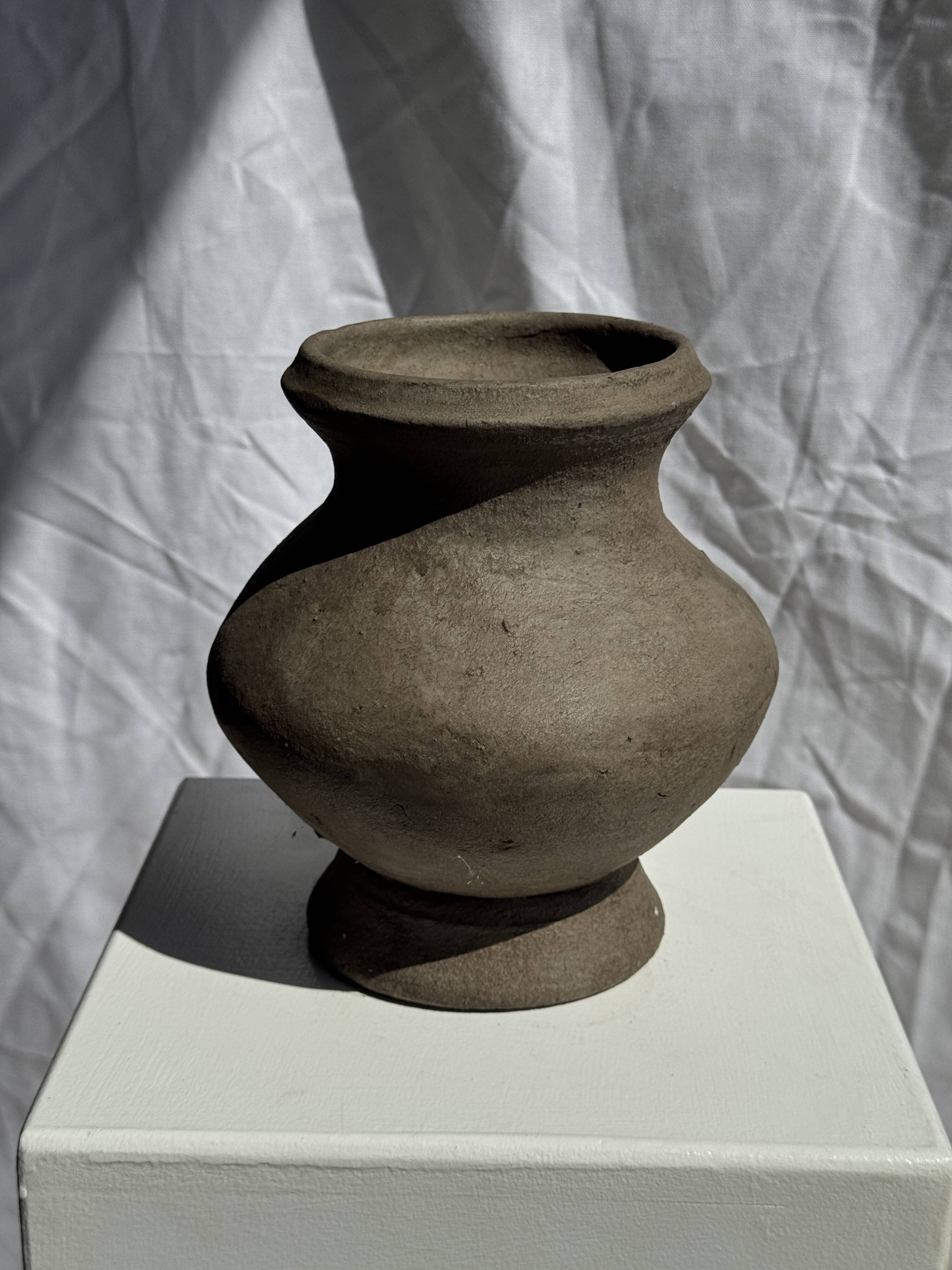 Small brutalist handcrafted terracotta vase with a pedestal, Indonesian, H19 D17.