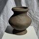 Small brutalist handcrafted terracotta vase with a pedestal, Indonesian, H19 D17.