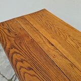 Solid oak bistro table with a cast iron base, signed.