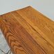Solid oak bistro table with a cast iron base, signed.