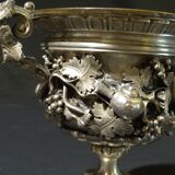 Carved silver bronze vase mounted on marble pedestal