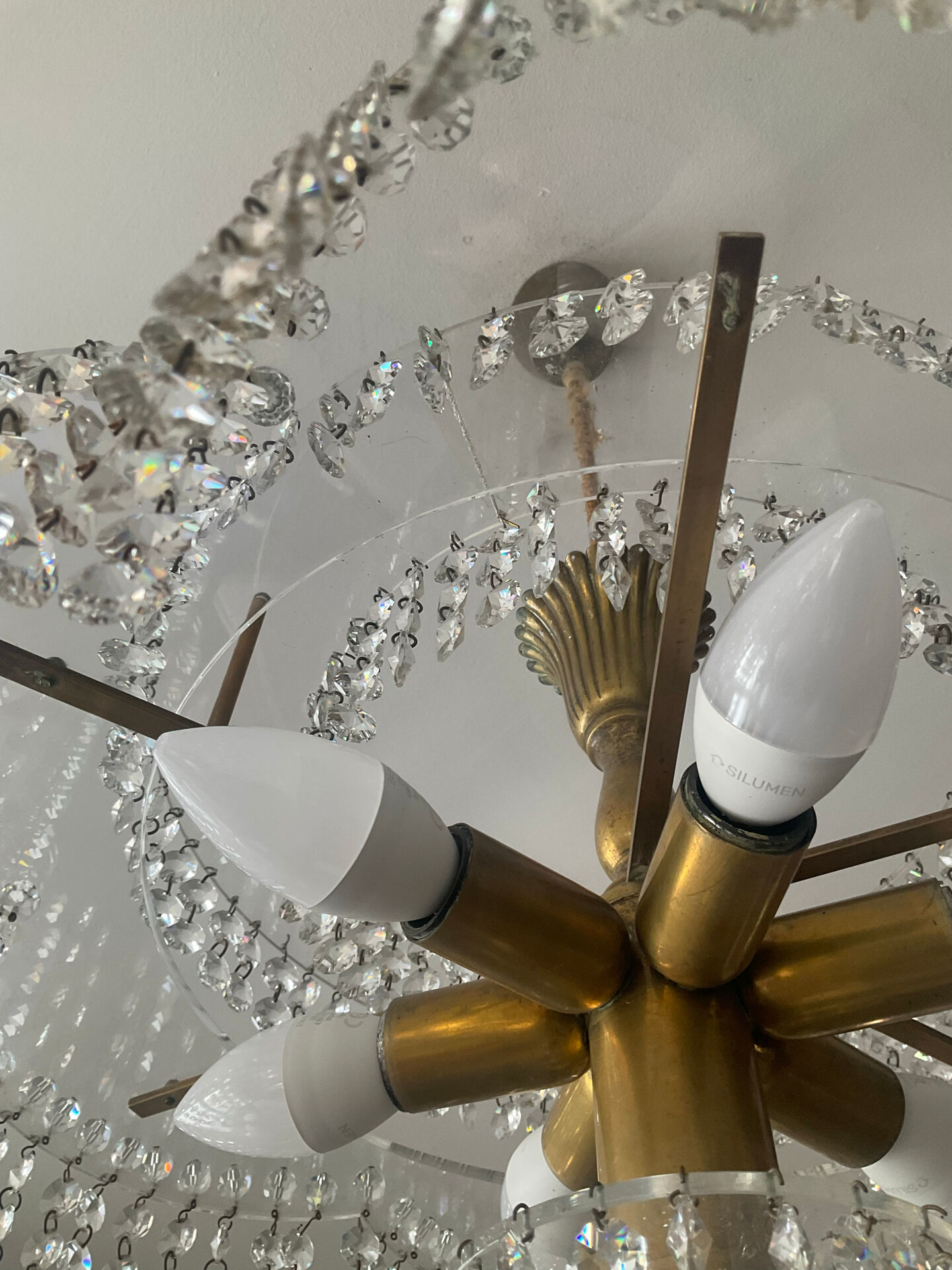 Vintage lucite chandelier with a cascade of crystal pendants from the 1970s.