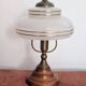 Vintage lamp made of turned wood, brass, and frosted glass.