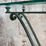 Console in glass and antique patinated metal