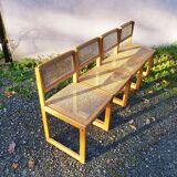 Four trendy tanned wooden chairs